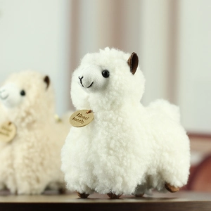 Detailed close-up of white alpaca plush toy with wool fur and wooden Hand Made tag