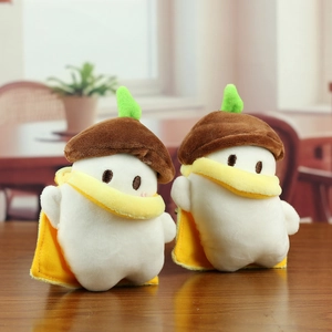 Cute long-tailed tit plush toy with acorn hat and yellow cloak on a wooden table