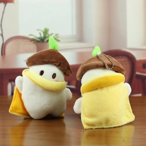 Cute long-tailed tit plush toy keychain with yellow cloak and green sprout on acorn hat