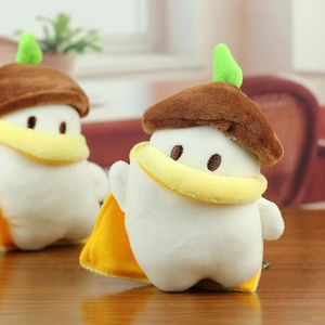 Detail of plush bird toy with brown acorn hat, yellow scarf and metal keychain link