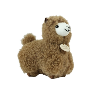 Soft brown alpaca plush keychain with thick curly fur and handmade circular neck tag