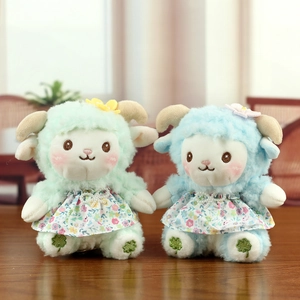 Cute plush sheep pendants in green and blue floral dresses with flower hair accessories