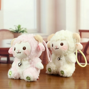 Close-up of plush sheep charms with pearl necklaces, curly texture and silicone straps