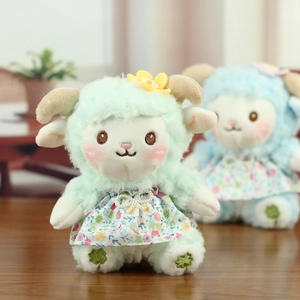 Close-up of cute plush sheep toys with floral dresses and embroidery details