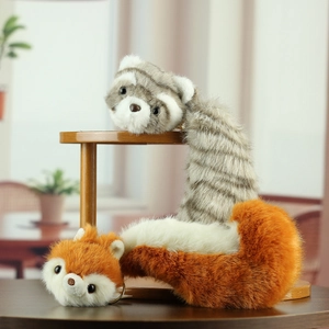 Realistic red panda and ferret plush keychain toys on a wooden display shelf