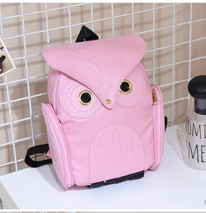 Pink owl backpack for women with feather stitching and 3D eye details on a white background