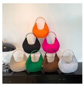 Detailed view of trendy felt hobo bags with crocodile pattern in multiple vibrant colors
