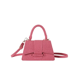 French style woven pink hourglass handbag with curved base and adjustable shoulder strap