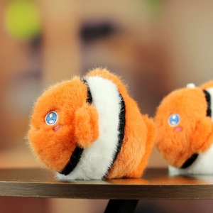 Detailed view of plush clownfish charms with soft fur texture and cute embroidered eyes