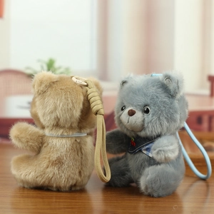 Detailed view of fluffy bear plush pendants with cute scarves and woven lanyards