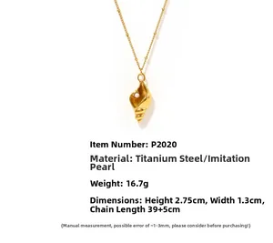 Detailed macro of gold-plated conch shell pendant with pearl and titanium steel specs