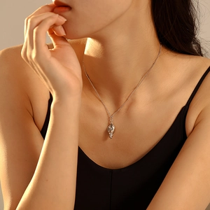 Chic 18k gold plated conch shell necklace with imitation pearl worn on female neck