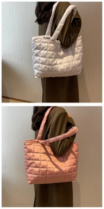 Detailed close-up of quilted tote bags in white and pink showing the soft puffer texture