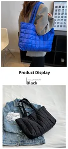 Close-up of quilted down tote bags in black and blue with reinforced wide shoulder straps