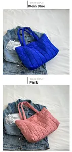 Quilted nylon tote bags shown in Klein blue and pink with square stitch texture