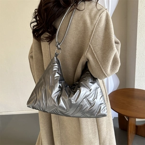 Fashion silver quilted shoulder bag with metallic finish and knot detail on strap