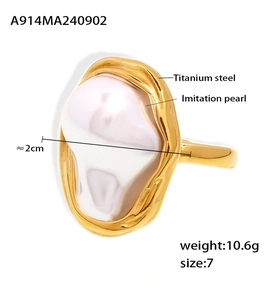 Detail shot of vintage hammered gold titanium steel ring with a large baroque pearl
