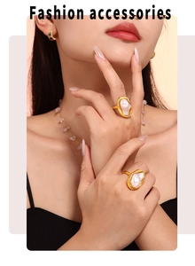 Baroque pearls set in molten gold texture rings, necklace and earrings on model