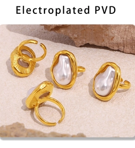 Macro detail of PVD gold plated rings with baroque irregular pearls in a retro style