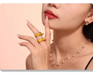 Detailed view of layered 18k gold plated geometric convex rings and zircon hoop earrings