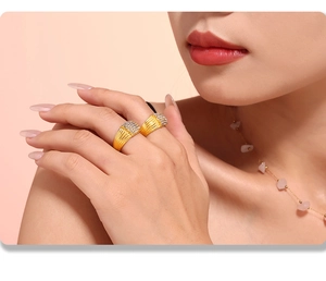 Detail of gold-plated rings with vertical stripes and micro-pave cubic zirconia crystals