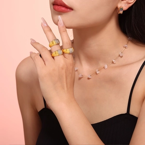 Gold multi-layer pave square rings and pink gemstone necklace on female model
