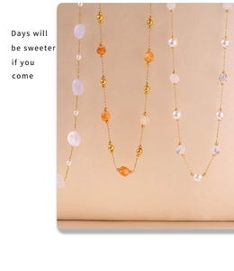 Detail of elegant 18K gold plated chains with natural stones and freshwater pearls