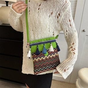 Ethnic bohemian canvas crossbody bag with green jacquard embroidery and colorful tassels