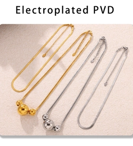 Detail of PVD electroplated stainless steel snake chain necklace with three polished spheres