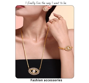 Evil Eye jewelry set with necklace, bracelet, and earrings on model in gold finish