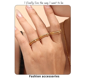 Detail of double-layer 18k gold plated rings with 3A cubic zirconia and beaded texture
