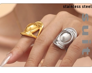 Polished gold and silver stainless steel wide rings in a minimalist dome design