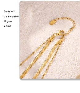 Detail of gold-plated layered snake chains with lobster clasp and extension chain