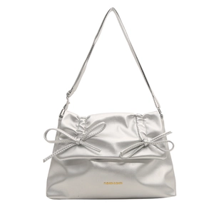 Silver metallic dumpling bag with ruffled details and bows for a chic modern look