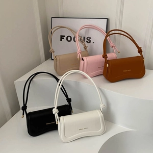 French style underarm bags in multiple colors with knot shoulder strap details