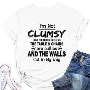 Detail of white cotton T-shirt with 'I'M NOT CLUMSY' slogan and rolled cuffs design