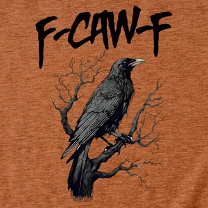 Close-up of eagle print and F-CAW-F text on caramel cotton t-shirt fabric texture