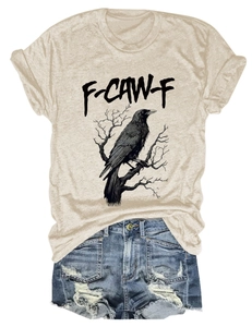 Flat lay of beige cotton T-shirt with eagle print and ripped denim shorts set