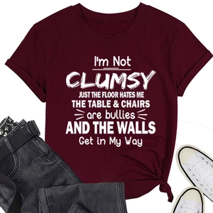 Flat lay of maroon T-shirt with white slogan print and stylish front knot detail