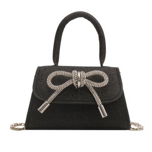 Mini black handbag with sparkling sequins, rhinestone bow, and silver chain strap