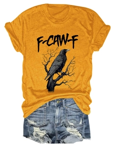 Detail of raven print and artistic F-CAW-F text on a yellow crew neck cotton T-shirt