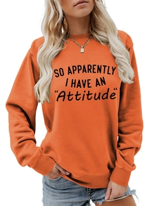 Orange crewneck sweatshirt with SO APPARENTLY I HAVE AN ATTITUDE slogan text