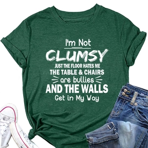 Detail of soft dark green cotton T-shirt with humorous white text and casual denim