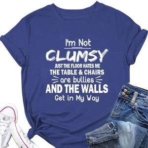 Detail of navy blue cotton t-shirt featuring I'M NOT CLUMSY funny quote and rolled sleeves