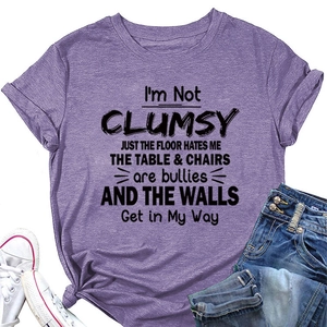 Detail of purple heather t-shirt featuring I'M NOT CLUMSY print and stylish waist knot