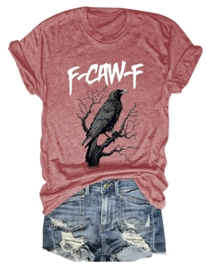 Flat lay of rust red T-shirt with eagle print and distressed denim shorts outfit