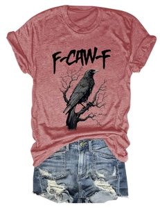 Flat lay of terracotta cotton t-shirt with crow graphic print and denim shorts