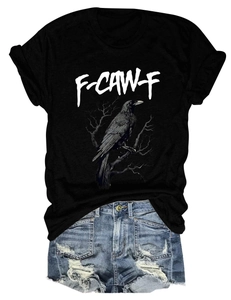 Detailed view of black eagle print t-shirt and distressed denim shorts on white background