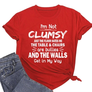 Detail view of the soft red cotton fabric and white humor slogan print on this t-shirt