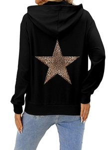 Detail of the leopard print star pattern on the back of this black oversized hoodie